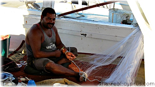 Man Fixing Fishing Nets